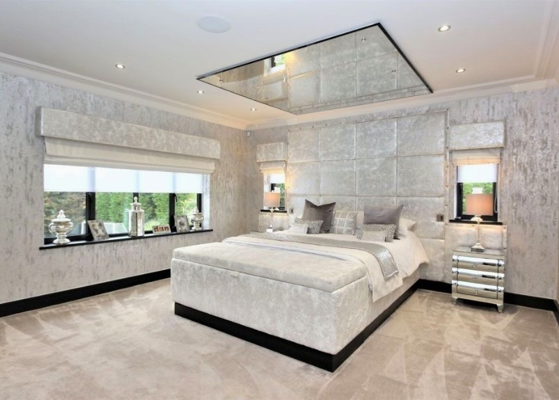 Mirror or Glossy Panels for a Spacious Feel Modern Bedroom Ceiling Designs