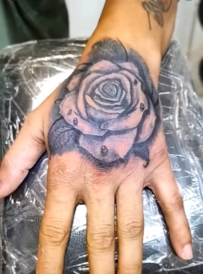 Rose Tattoo hand tattoos for men